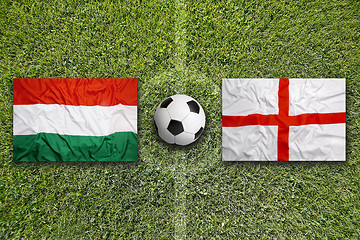 Image showing Hungary vs. England flags on soccer field