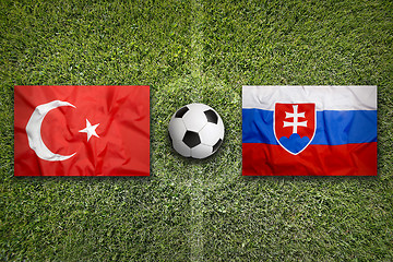 Image showing Turkey vs. Slovakia flags on soccer field