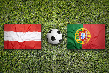 Image showing Austria vs. Portugal flags on soccer field