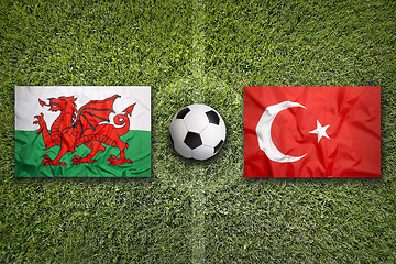 Image showing Wales vs. Turkey flags on soccer field