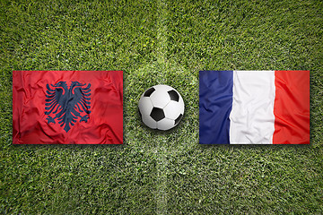 Image showing Albania vs. France flags on soccer field