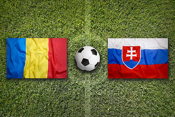 Image showing Romania vs. Slovakia flags on soccer field