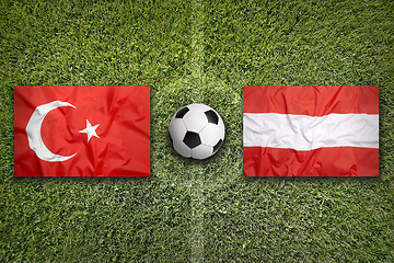 Image showing Turkey vs. Austria flags on soccer field