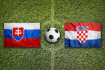 Image showing Slovakia vs. Croatia flags on soccer field