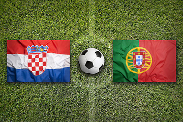 Image showing Croatia vs. Portugal flags on soccer field