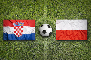 Image showing Croatia vs. Poland flags on soccer field