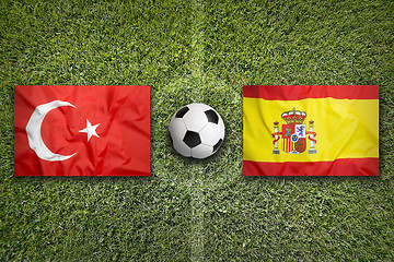 Image showing Turkey vs. Spain flags on soccer field