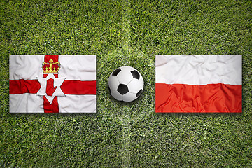 Image showing Northern Ireland vs. Poland flags on soccer field