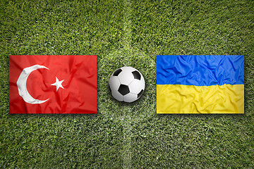 Image showing Turkey vs. Ukraine flags on soccer field