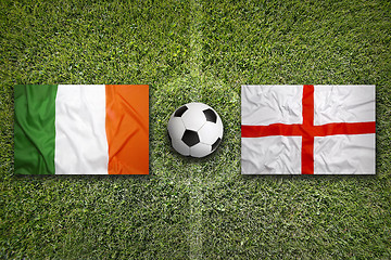 Image showing Ireland vs. England flags on soccer field