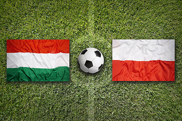 Image showing Hungary vs. Poland flags on soccer field