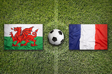 Image showing Wales vs. France flags on soccer field