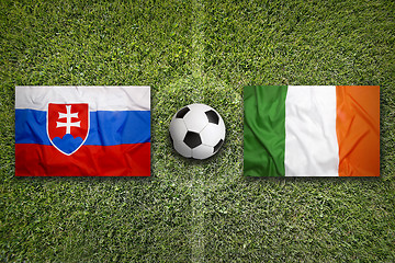 Image showing Slovakia vs. Ireland flags on soccer field