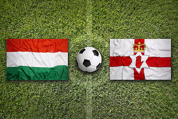 Image showing Hungary vs. Northern Ireland flags on soccer field