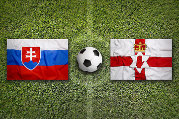 Image showing Slovakia vs. Northern Ireland flags on soccer field