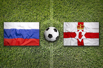 Image showing Russia vs. Northern Ireland flags on soccer field