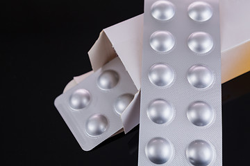 Image showing Silver blister pack of small pills