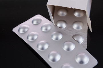 Image showing Silver blister pack of small pills