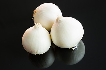 Image showing Three whole fresh raw white onions