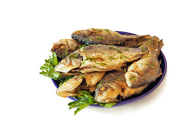 Image showing Roasted carp on a plate on a white background.