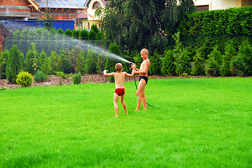 Image showing boys play on the grass