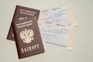 Image showing Volgograd, Russia - August 12, 2015: Two passport of the citizen of the Russian Federation and two tickets on a train