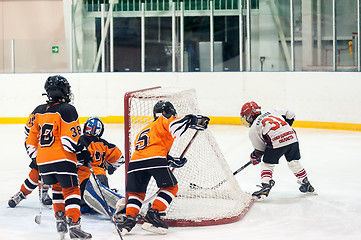 Image showing Game between children ice-hockey teams