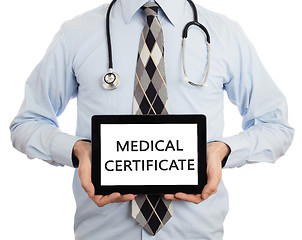 Image showing Doctor holding tablet - Medical certificate