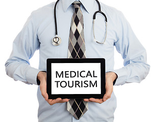 Image showing Doctor holding tablet - Medical tourism