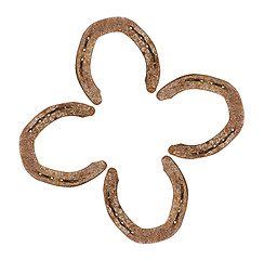 Image showing Horseshoes forming a clover leaf