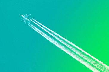 Image showing Plane in blue sky - Bright green sky