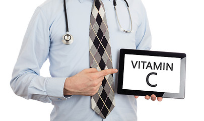 Image showing Doctor holding tablet - Vitamin C