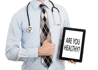 Image showing Doctor holding tablet - Are you healthy?