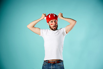 Image showing The face of football fan with different emotions on blue