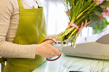 Image showing close up of woman making bunch at flower shop