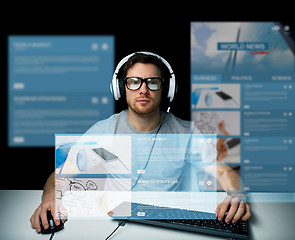 Image showing man in headset computer over virtual media screens