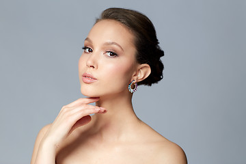 Image showing close up of beautiful woman face with earring