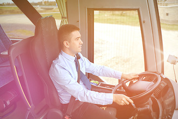 Image showing happy driver driving intercity bus