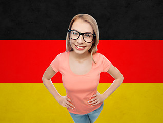 Image showing happy young woman or teenage girl in eyeglasses