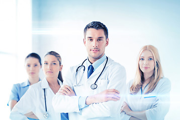 Image showing male doctor in front of medical group