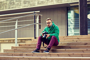 Image showing young hipster man with digital camera in city
