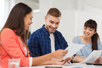 Image showing happy creative team or students working at office