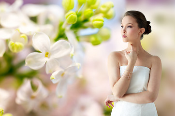 Image showing beautiful asian woman with golden bracelet