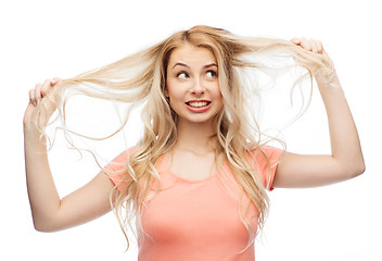 Image showing woman holding strand of her hair