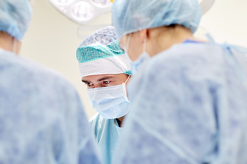 Image showing group of surgeons in operating room at hospital