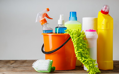 Image showing Bucket with cleaning items on light background