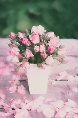 Image showing Roses in white vase on a wooden table