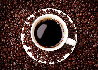 Image showing cup of coffee and coffee beans