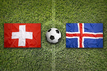 Image showing Switzerland vs. Iceland flags on soccer field