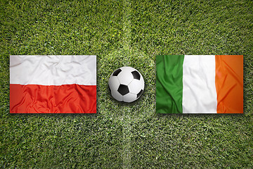 Image showing Poland vs. Ireland flags on soccer field